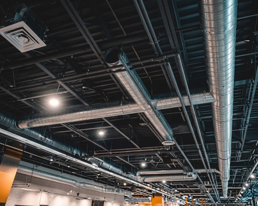 Exposed Commercial Mechanical Ventilation Ductwork in a Modern Office Space